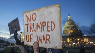 Protesters hold signs at the US Capitol to for the Anti-Iran War Rally on January 2020 in Washington D.C.