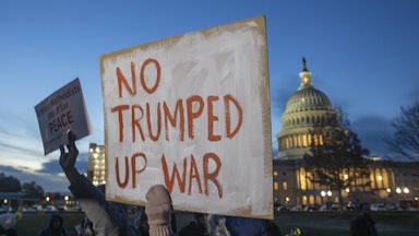 Protesters hold signs at the US Capitol to for the Anti-Iran War Rally on January 2020 in Washington D.C.