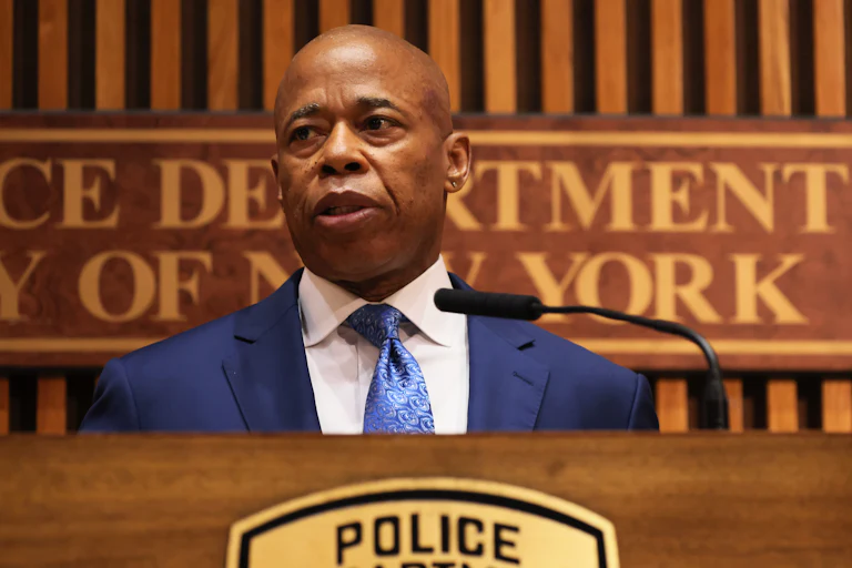 NYC Mayor Eric Adams speaks at a podium