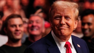 Donald Trump does that goofy toothless grin he does.