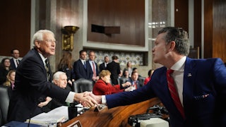 President-elect Donald Trump's nominee for Secretary of Defense Pete Hegseth greets Senate Armed Services Committee Chairman Sen. Roger Wicker during his confirmation hearing on Capitol Hill on January 14, 2025.