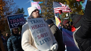 Transgender rights supporters rally outside of the U.S. Supreme Court as the high court hears arguments in a case on transgender health rights in Washington, D.C.
