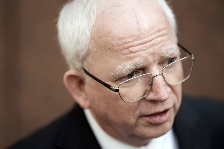 John Eastman looks off-camera