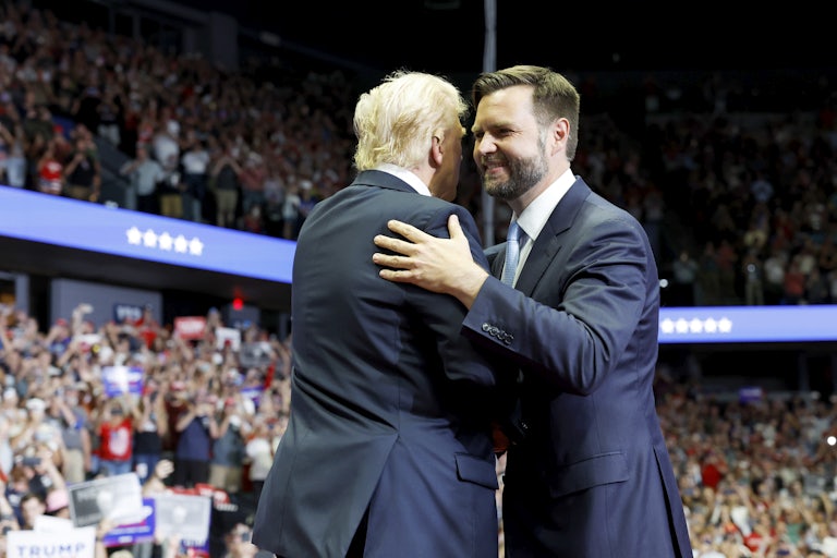 J.D. Vance embraces Donald Trump, with a hand on his shoulder, at the RNC