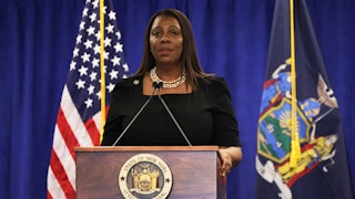 Letitia James stands at a podium