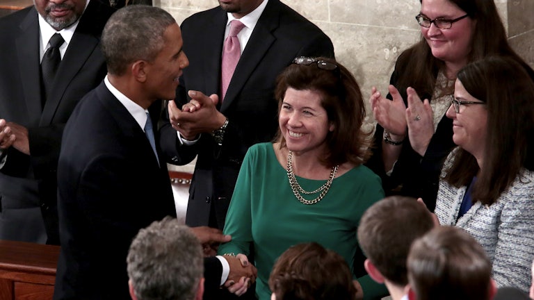 A smiling Elizabeth MacDonough shakes the hand of President Barack Obama after his 2015 State of the Union address.