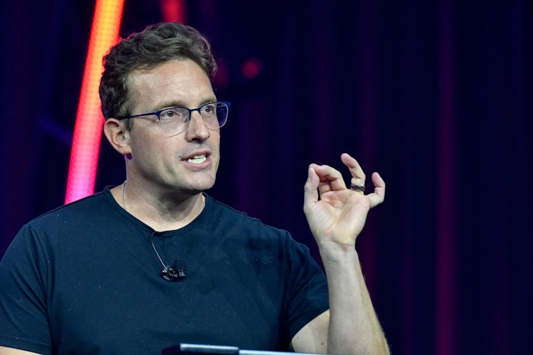 Benny Johnson speaks and makes a hand gesture