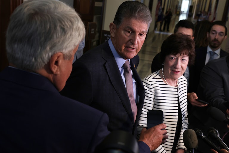 Senators Joe Manchin and Susan Collins speak to members of the media after they testified at a hearing about the Electoral Count Act.