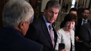 Senators Joe Manchin and Susan Collins speak to members of the media after they testified at a hearing about the Electoral Count Act.