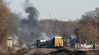 Smoke rises from a derailed cargo train in East Palestine, Ohio.