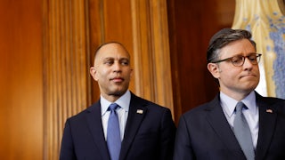 Hakeen Jeffries and Mike Johnson stand next to each other