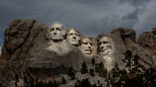 A picture of Mount Rushmore with the faces illuminated.