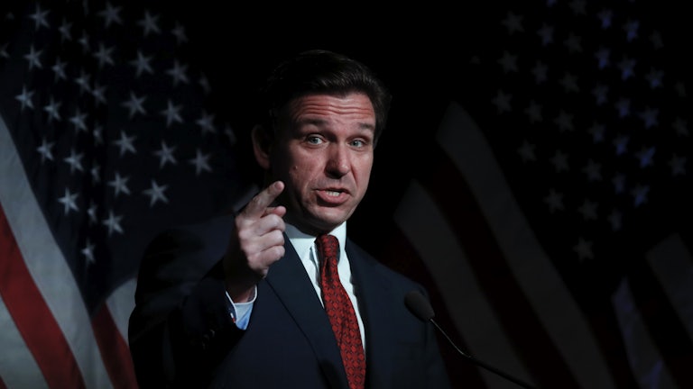 Ron DeSantis points while speaking.