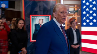 Donald Trump walks onto the floor of the New York Stock Exchange after being named TIME’s “Person of the Year.”