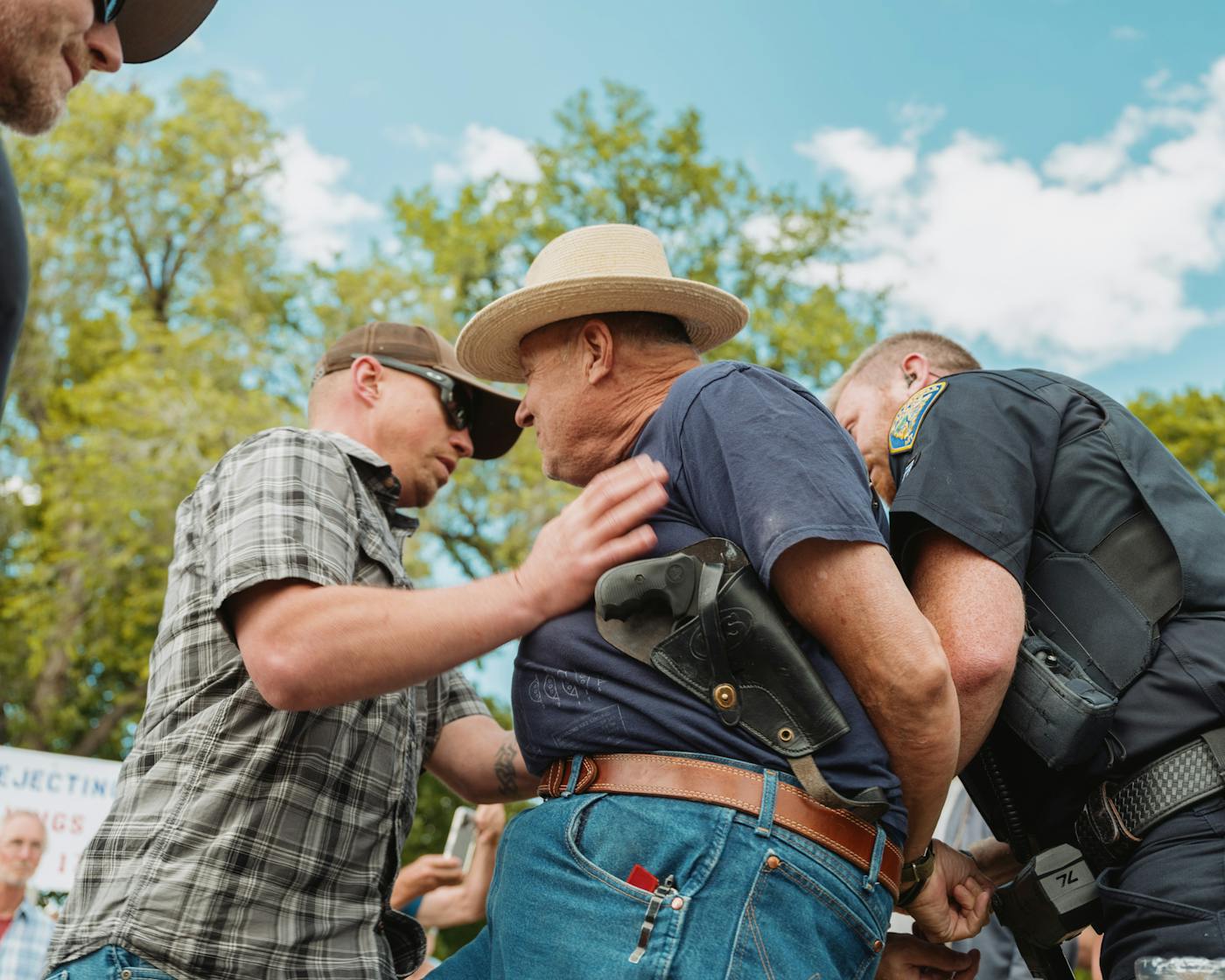 Police arrest an armed demonstrator after he interfered with their attempt to arrest another demonstrator at the No Kings Rally in Kalispell, MT on June 14.