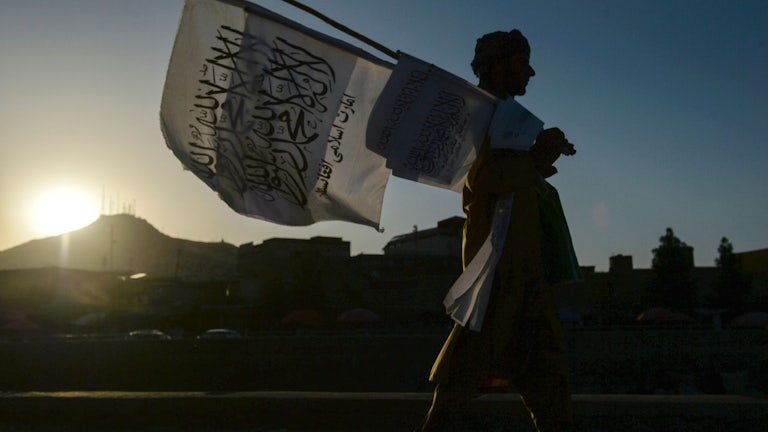 A man sells Taliban flags in Kabul