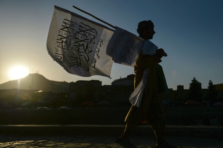 A man sells Taliban flags in Kabul 
