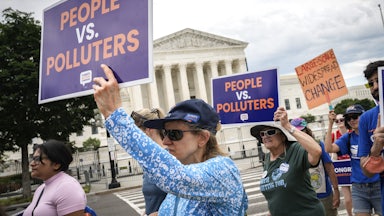 Environmental activists rally in front of the U.S. Supreme Court.