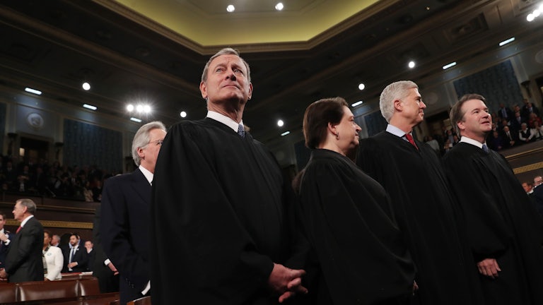 Chief Justice John Roberts waits to hear President Donald Trump deliver the State of the Union address.