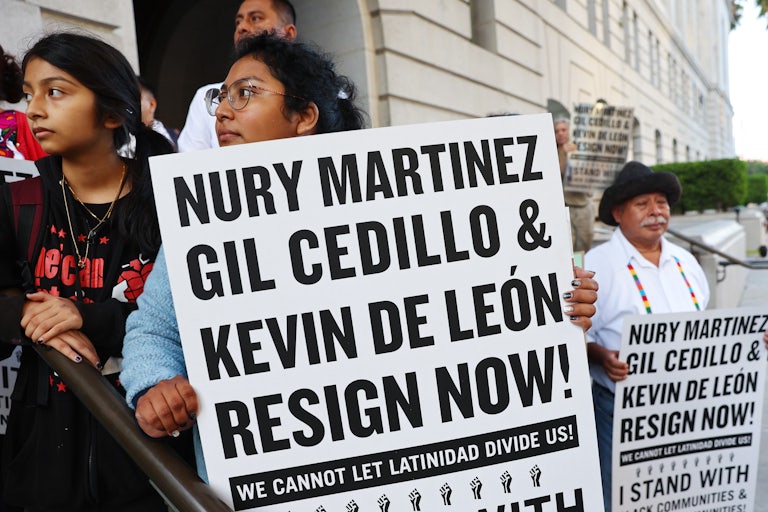 Protesters call for the resignation of three Los Angeles City Councilmembers after the public disclosure of a profanity-laced recording which revealed racist comments amid a discussion of city redistricting.