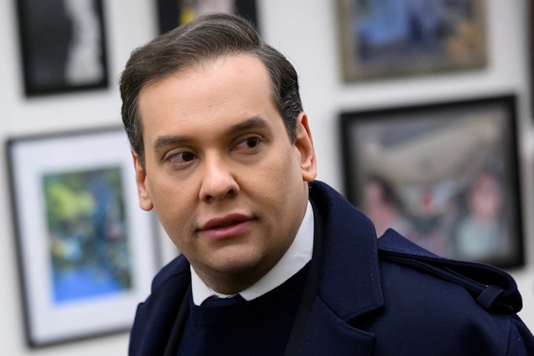 George Santos looks to the side