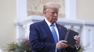 Trump attempts to look extremely natural holding the Bible