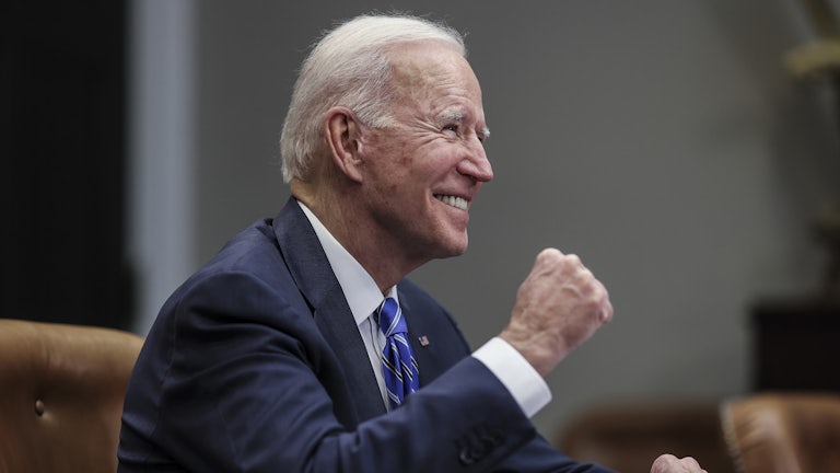 President Joe Biden celebrates with a fist pump at the White House.