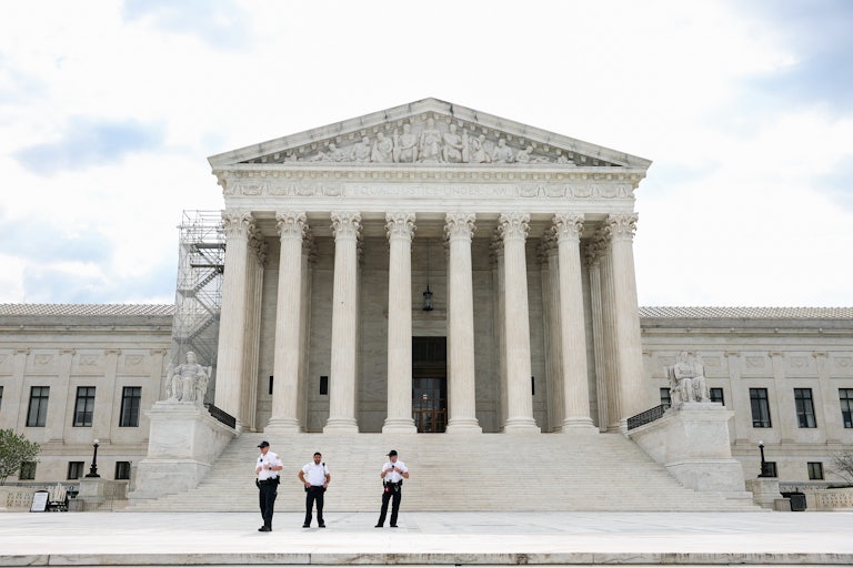 A shot of the Supreme Court building in daylight.
