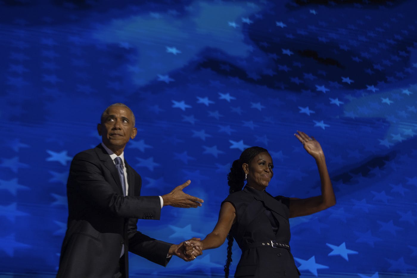 Barack Obama gestures to his wife Michelle after her speech 