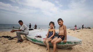 Palestinians at the beach in Deir al-Balah, Gaza