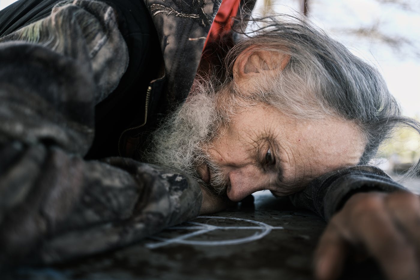 Tim Kincaid rests his head on a picnic table at Morrison Park. Kincaid is 59 was born in Grants Pass.