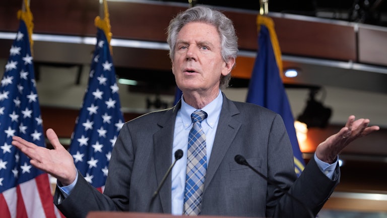 Frank Pallone gesticulates at a press conference.