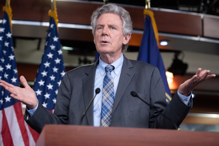 Frank Pallone gesticulates at a press conference.