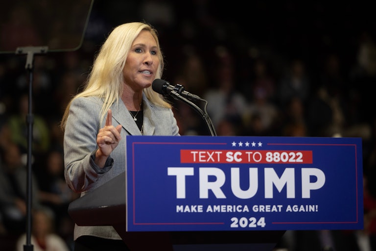 Marjorie Taylor Greene speaks at a podium