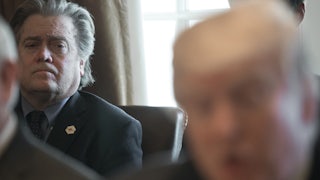 Steve Bannon listens to Trump at a Cabinet meeting