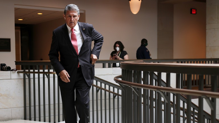 Joe Manchin reaches into his pocket.