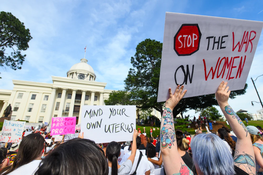 Demonstrators participate in a 2019 rally against restrictive bans on abortions outside the Alabama statehouse.