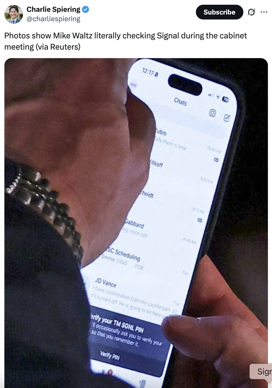 X screenshot Charlie Spiering @charliespiering Photos show Mike Waltz literally checking Signal during the cabinet meeting (via Reuters) (photo of Mike Waltz using TM Signal)