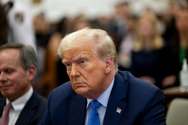 Donald Trump sits in court and stares off camera