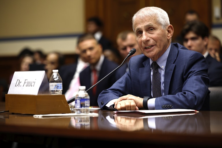 Anthony Fauci speaks into a microphone