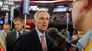 Kevin McCarthy speaks to a reporter on the House floor