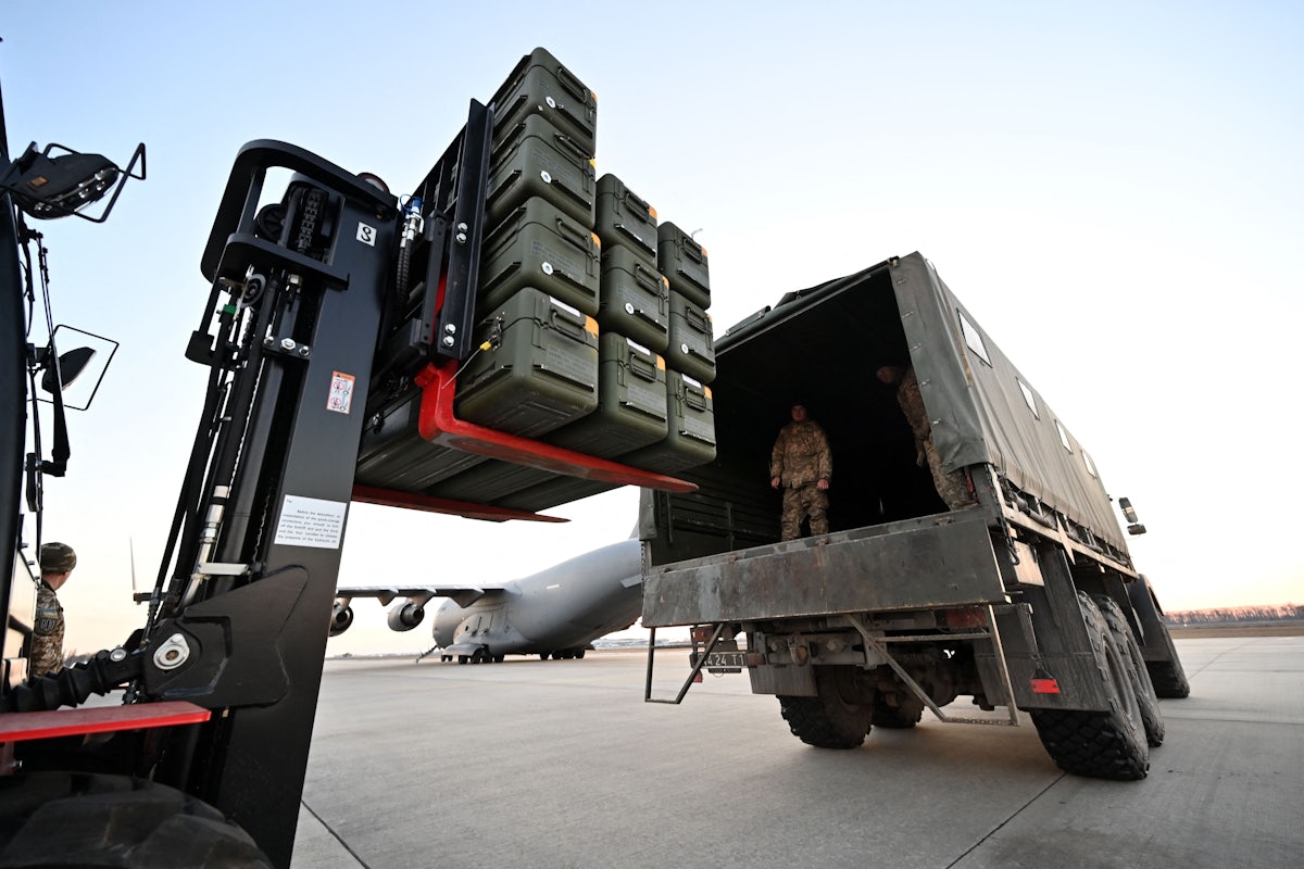 Ukrainian soldiers load U.S.-made Stinger missiles onto a truck at Boryspil Airport in Kyiv