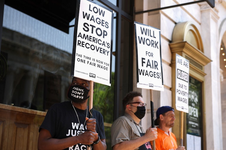 Activists with One Fair Wage participate in a “Wage Strike" demonstration outside of the Old Ebbitt Grill in Washington DC.