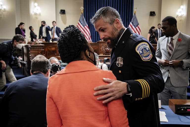 Officer Michael Fanone greets Representative Sheila Jackson-Lee during a hearing of the January 6th commission.