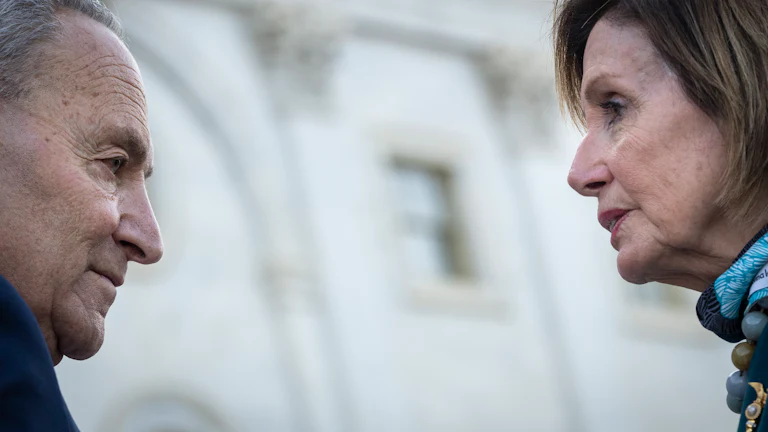 Chuck Schumer and Nancy Pelosi on the steps of the U.S. Capitol