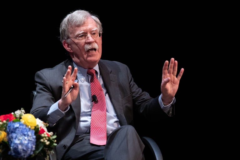 John Bolton gestures while speaking