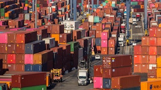 Shipping containers and trucks at the Port of Los Angeles in San Pedro, California.