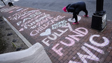 MomsRising sidewalk art asks lawmakers to expand the Child Tax Credit.