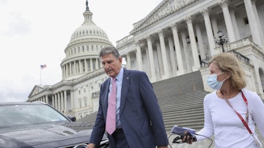 West Virginia Senator Joe Manchin walks down the steps of the U.S. Capitol