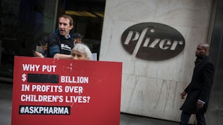 Protesters picket outside Pfizer's Manhattan office, demanding equitable global access to vaccines. 